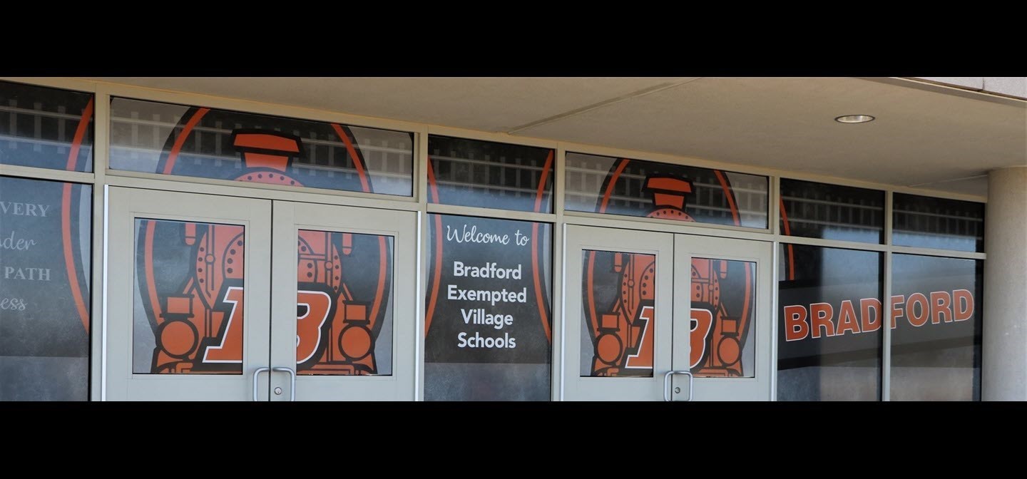 Welcome to Bradford Exempted Village Schools text on a school building entrance