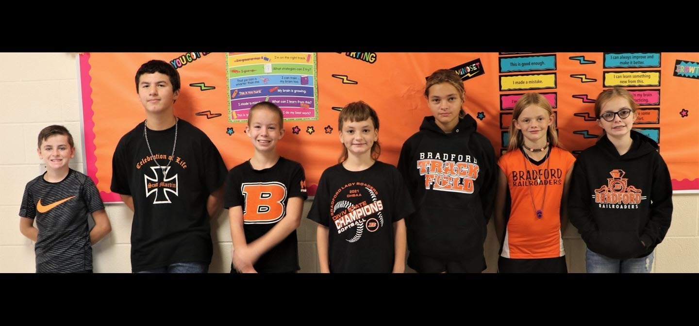 students in hallway lined up for photo