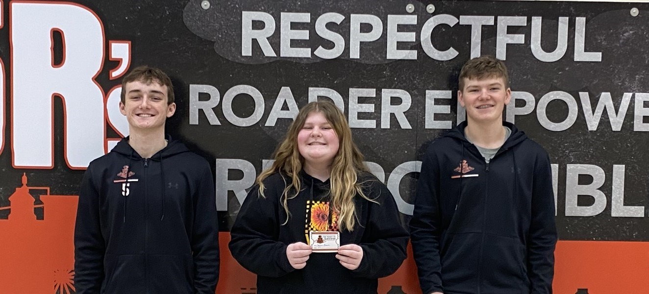 3 students smiling for a photo